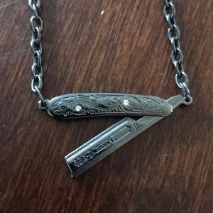 Sourpuss straight razor necklace